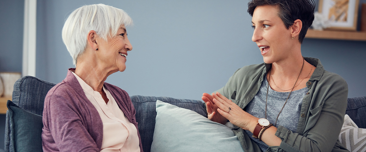 an adult daughter talking to her mother about assisted living