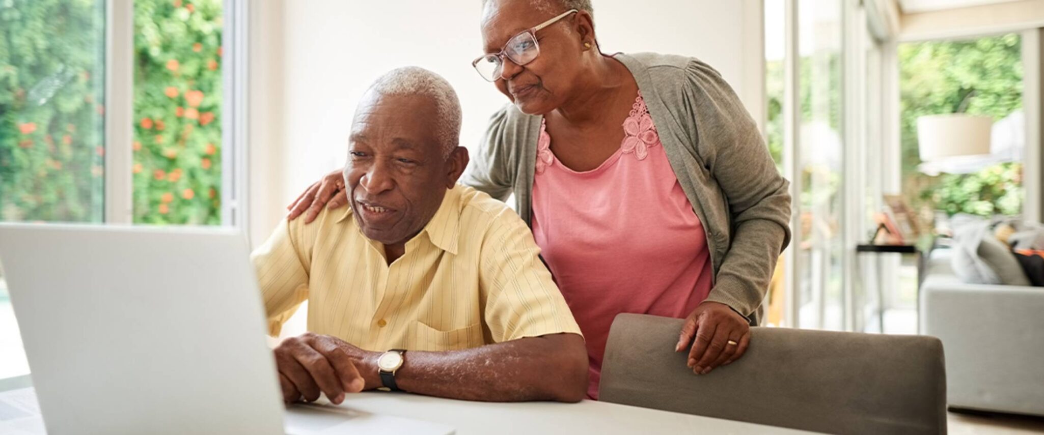 Senior couple looking online to learn about senior living tax deductions