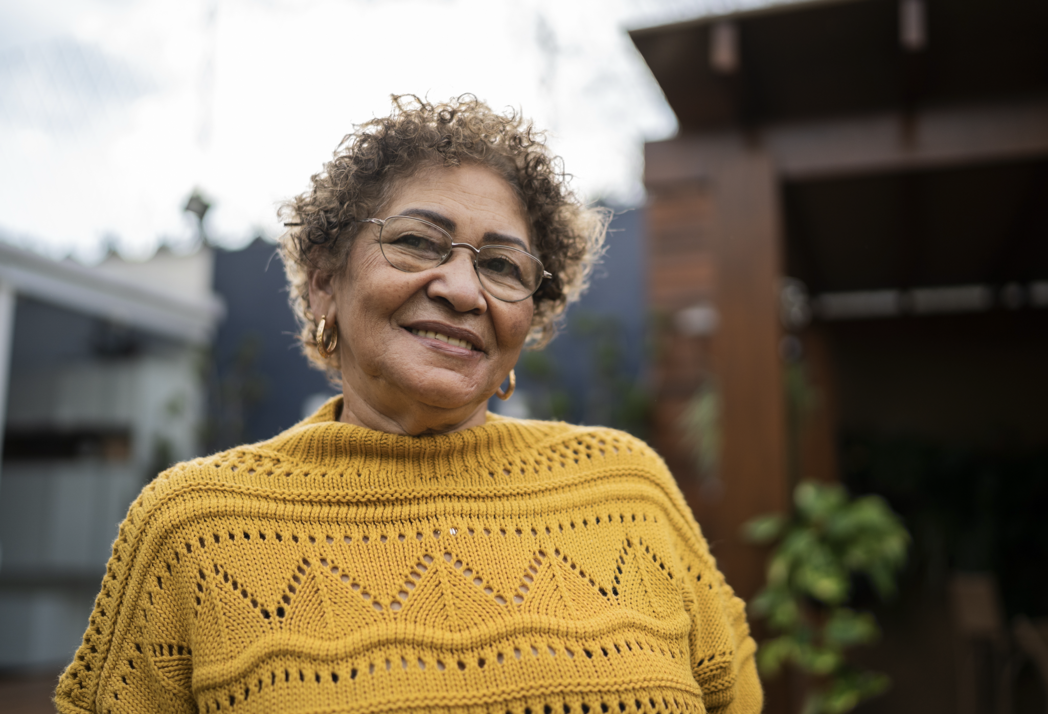 Senior woman smiling outside